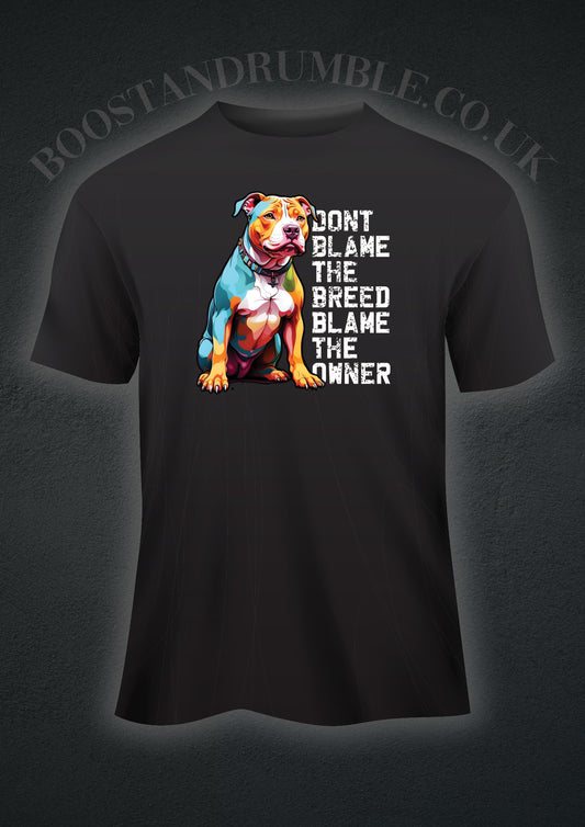 Vibrant and powerful XL Bully Dog T-shirt featuring a bold and colorful portrayal of an XL Bully, celebrating their beauty and strength. The shirt carries the empowering message 'Don't Blame The Breed,' challenging stereotypes and promoting understanding